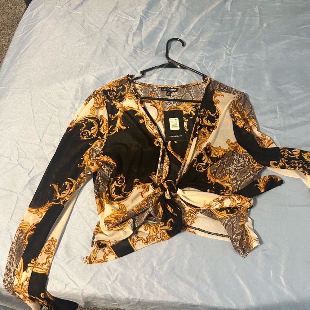 Fashion Nova Black and Gold Tie Front Graphic Blouse